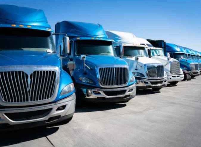 managed transportation services lined up trucks