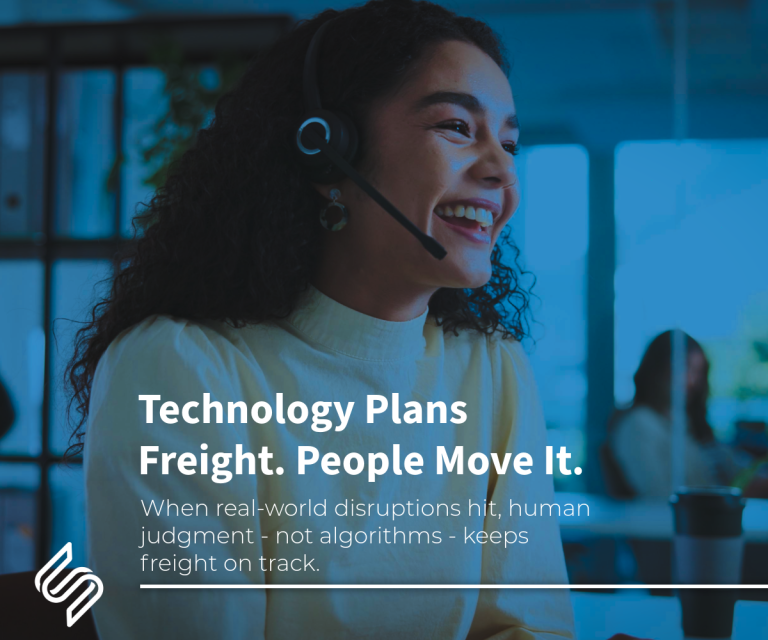 Customer service professional wearing a headset in a modern logistics operations office, representing human expertise behind freight execution.